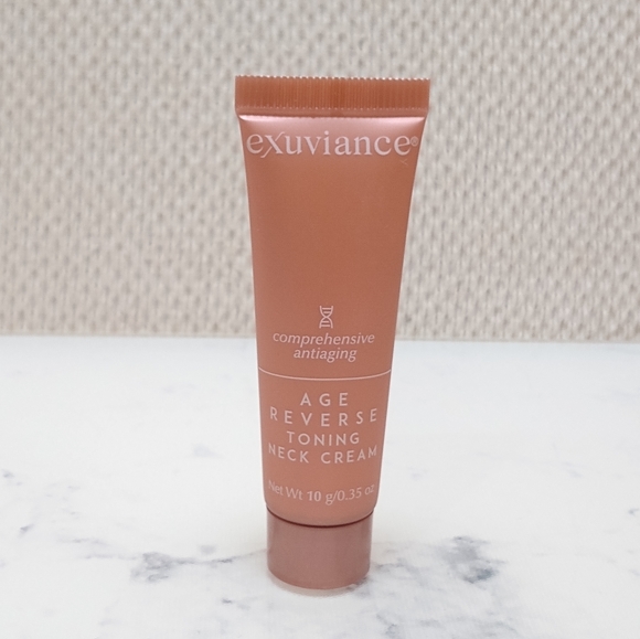 New Exuviance Age Reverse Toning Neck Cream Mini Travel Size .35 oz/10 g - Picture 1 of 3